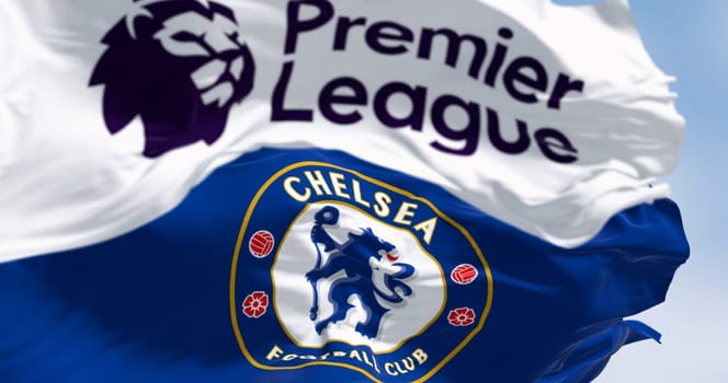 London, UK, July 12 2023: Chelsea Football Club and Premier League flags waving on a clear day. Rippled Fabric. Selective focus. Illustrative editorial 3d illustration render