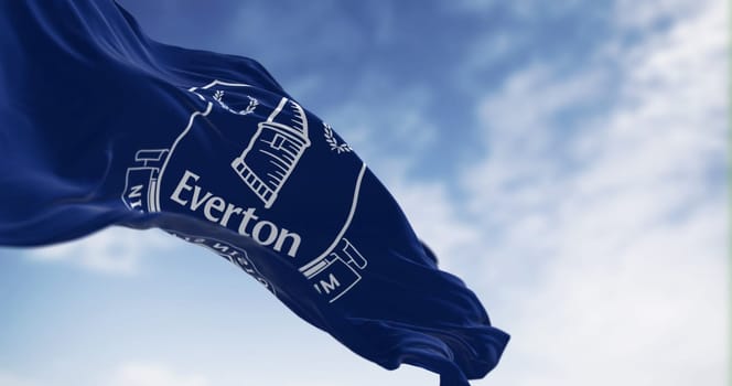 Liverpool, UK, Sept. 21 2023: Everton Football Club flag waving on a clear day. Professional english football club. Illustrative editorial 3d illustration render. English Premier League