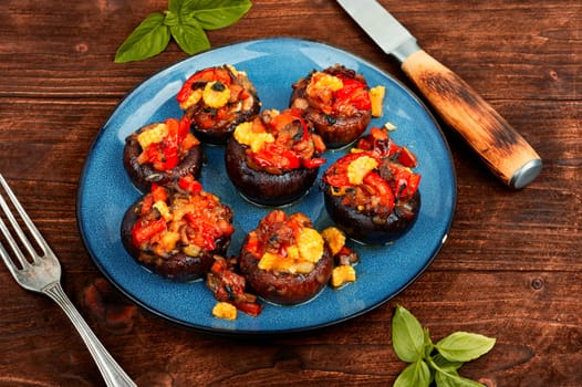 Mushroom, champignons caps baked stuffed with bell pepper and corn