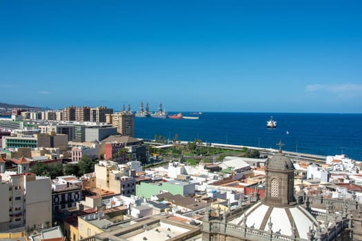 Panoramic view from above of the capital Las Palmas Gran Canaria in Spain with part of the Santa Ana Cathedral and views to the harbor and the sea