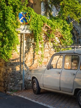 NO PARKING sign with car on background