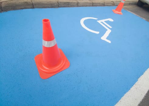 Reserved parking for vehicles of people with disabilities. Just painted floor signal