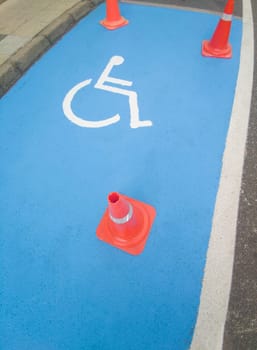 Reserved parking for vehicles of people with disabilities. Just painted floor signal