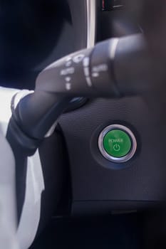 Start button of a hybrid or electric car. Eco driving concept