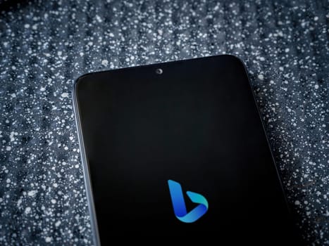 Lod, Israel - July 16,2023: Bing Browser app launch screen on smartphone on metallic background. Close up top view flat lay.