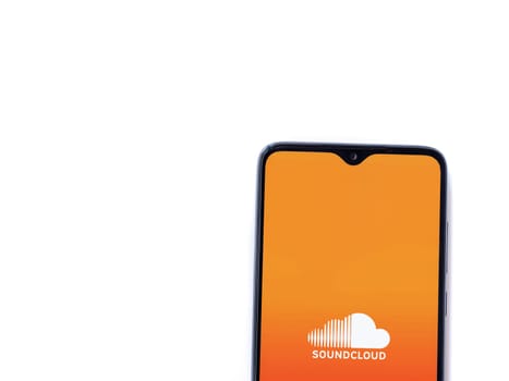 Lod, Israel - July 16,2023: SoundCloud app launch screen on smartphone on white background. Top view flat lay with copy space.