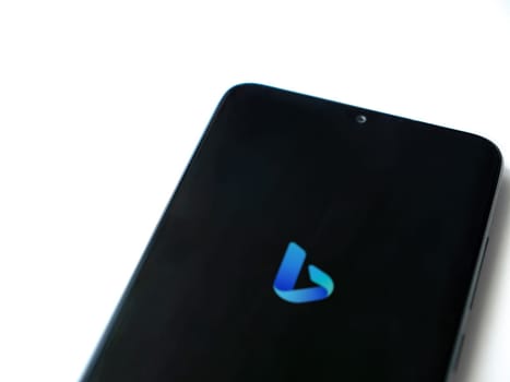Lod, Israel - July 16,2023: Bing Browser app launch screen on smartphone on white background. Top view flat lay with copy space.