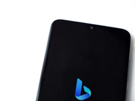Lod, Israel - July 16,2023: Bing Browser app launch screen on smartphone on white background. Top view flat lay with copy space.