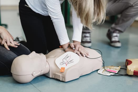 First aid cardiopulmonary resuscitation course using automated external defibrillator device, AED.