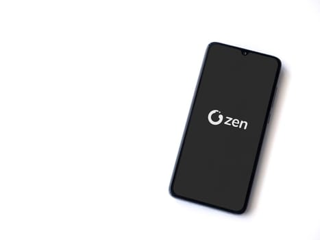 Lod, Israel - July 16,2023: ZEN.COM app launch screen on smartphone on white background. Top view flat lay with copy space.