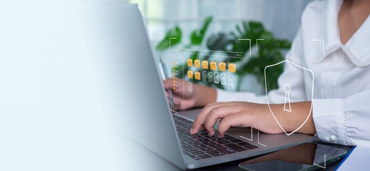 Businesswoman using computer to login represents protection concept of cyber security and data security including secure login.