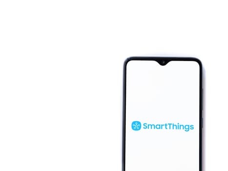 Lod, Israel - July 16,2023: Smartthings app launch screen on smartphone on white background. Top view flat lay with copy space.