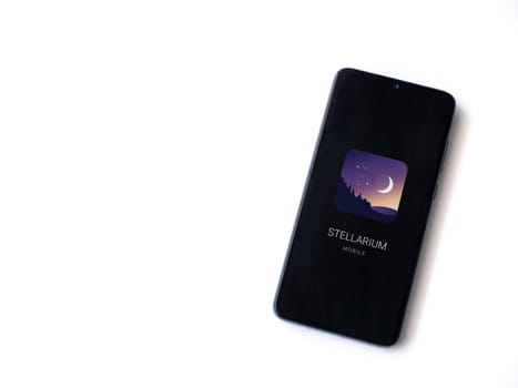 Lod, Israel - July 16,2023: Stellarium - Star Map app launch screen on smartphone on white background. Top view flat lay with copy space.