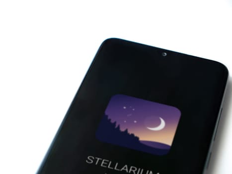 Lod, Israel - July 16,2023: Stellarium - Star Map app launch screen on smartphone on white background. Top view flat lay with copy space.