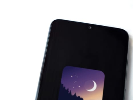 Lod, Israel - July 16,2023: Stellarium - Star Map app launch screen on smartphone on white background. Top view flat lay with copy space.
