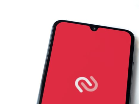 Lod, Israel - July 16,2023: Twilio Authy Authenticator app launch screen on smartphone on white background. Top view flat lay with copy space.
