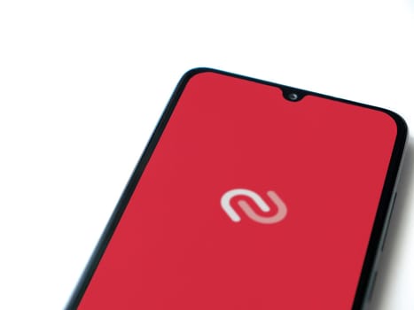 Lod, Israel - July 16,2023: Twilio Authy Authenticator app launch screen on smartphone on white background. Top view flat lay with copy space.