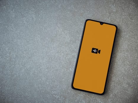 Lod, Israel - July 16,2023: USB Camera app launch screen on smartphone on ceramic stone background. Top view flat lay with copy space.