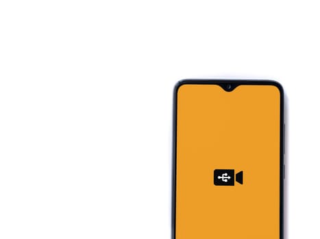 Lod, Israel - July 16,2023: USB Camera app launch screen on smartphone on white background. Top view flat lay with copy space.