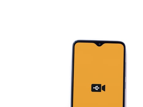 Lod, Israel - July 16,2023: USB Camera app launch screen on smartphone on white background. Top view flat lay with copy space.