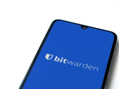 Lod, Israel - July 16,2023: Bitwarden Password Manager app launch screen on smartphone on white background. Top view flat lay with copy space.