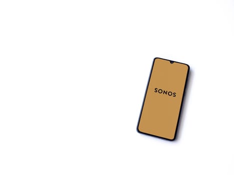 Lod, Israel - July 16,2023: Sonos app launch screen on smartphone on white background. Top view flat lay with copy space.