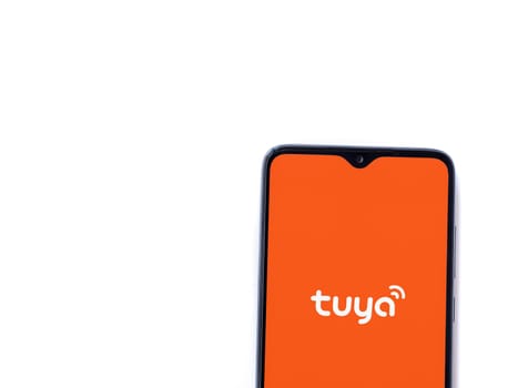 Lod, Israel - July 16,2023: Tuya Smart app launch screen on smartphone on white background. Top view flat lay with copy space.