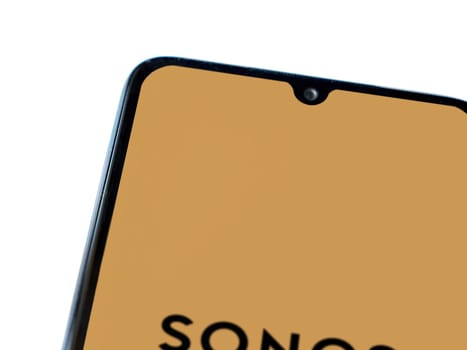 Lod, Israel - July 16,2023: Sonos app launch screen on smartphone on white background. Top view flat lay with copy space.