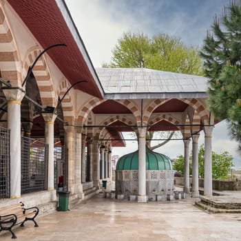 Ablution fountain in the courtyard of the Mihrimah Sultan Mosque in Uskudar, Istanbul, Turkey. The fountain is made of white marble and decorated with intricate carvings