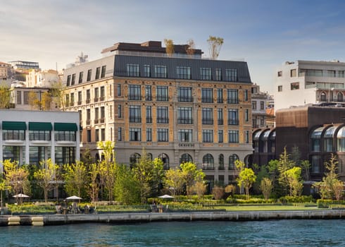Istanbul, Turkey - May 7 2023: Exterior of Peninsula five stars hotel, suited by Bosphorus Strait, beside Galataport, in a spring day