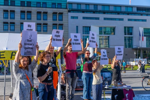 Berlin, Germany - 11 August 2023: Protesters with banners in support of a renowned activist and founder of WikiLeaks non profit organisation Julian Assange in the streets of Berlin