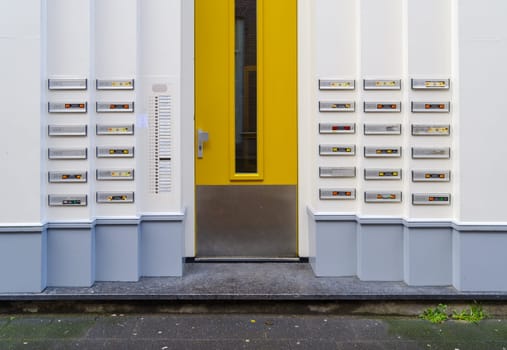 ZWOLLE, NETHERLANDS - MARCH 14, 2021: Lots of doorbells and name plates on an apartment building