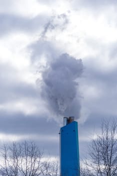 smoking chimney of a waste treatment plant