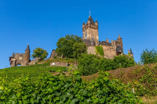 Cochem, Germany, August 10, 2023. Beautiful view of the hilltop castle (Reichsburg Cochem) in the touristic town of Cochem on the Moselle River in Rhineland-Palatinate in Germany.