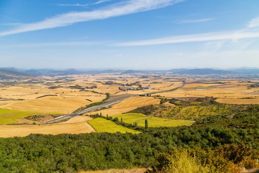 The way of Saint James track to Alto del Perdon top (Mount of Forgiveness), in Navarra, Spain