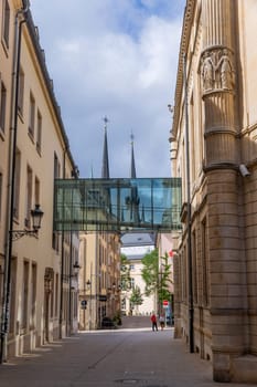 Luxembourg: August 1, 2023: View along Rue de l'Aeu towards Notre-Dame cathedral in the historic centre of Luxembourg City