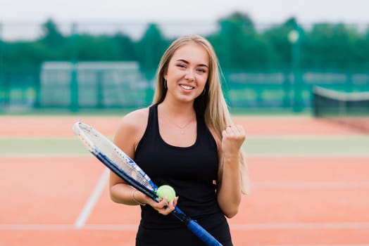 Tennis tournament. Female player at clay tennis court