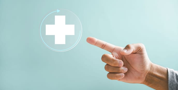 Health, medicine, and insurance fortify family business concept. A hand touches plus icon, shedding light on healthcare influence. Highlights hospital access and welfare health service growth.