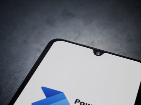 Lod, Israel - July 16,2023: Power Automate app launch screen on smartphone on dark marble stone background. Top view flat lay with copy space.