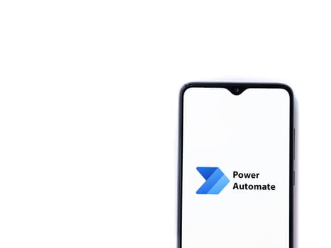 Lod, Israel - July 16,2023: Power Automate app launch screen on smartphone on white background. Top view flat lay with copy space.