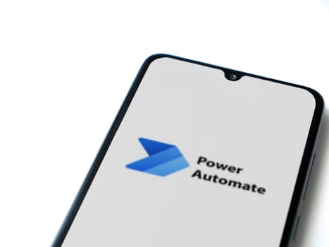 Lod, Israel - July 16,2023: Power Automate app launch screen on smartphone on white background. Top view flat lay with copy space.