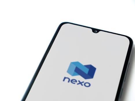Lod, Israel - July 16,2023: Nexo app launch screen on smartphone on white background. Top view flat lay with copy space.