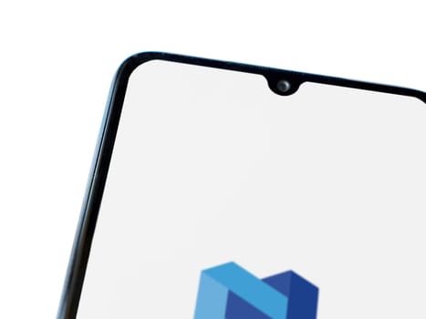 Lod, Israel - July 16,2023: Nexo app launch screen on smartphone on white background. Top view flat lay with copy space.