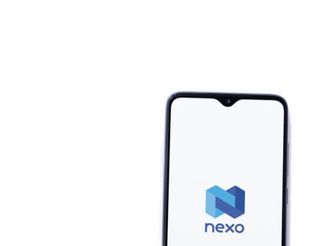 Lod, Israel - July 16,2023: Nexo app launch screen on smartphone on white background. Top view flat lay with copy space.