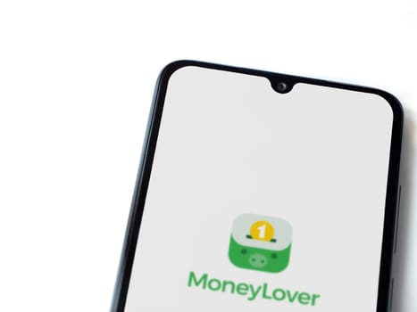 Lod, Israel - July 16,2023: Money Lover app launch screen on smartphone on white background. Top view flat lay with copy space.