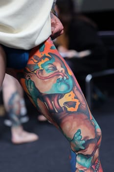 Krakow, Poland - June 12, 2022: Unidentified participant during the contest for the best tattoo at the 15th Tattoofest Convention in Cracow. One of the most prestigious tattoo festivals.