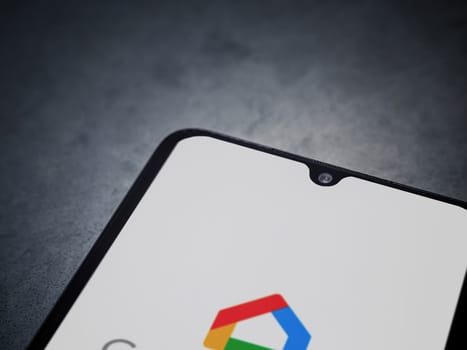Lod, Israel - July 16,2023: Google Home app launch screen on smartphone on dark marble stone background. Top view flat lay with copy space.