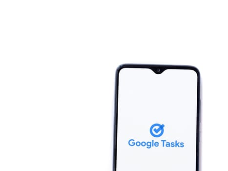 Lod, Israel - July 16,2023: Google Task app launch screen on smartphone on white background. Top view flat lay with copy space.