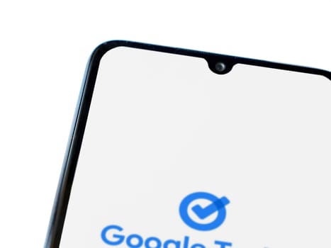 Lod, Israel - July 16,2023: Google Task app launch screen on smartphone on white background. Top view flat lay with copy space.
