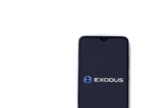 Lod, Israel - July 16,2023: Exodus app launch screen on smartphone on white background. Top view flat lay with copy space.